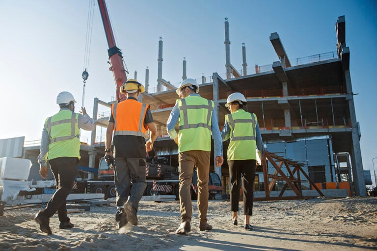 Diverse Team of Specialists Inspect Commercial Industrial Build