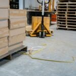Warehouse floor showing plastic strapping as a trip hazard