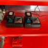 Li-ion batteries charging on an armorgard powerstor shelf